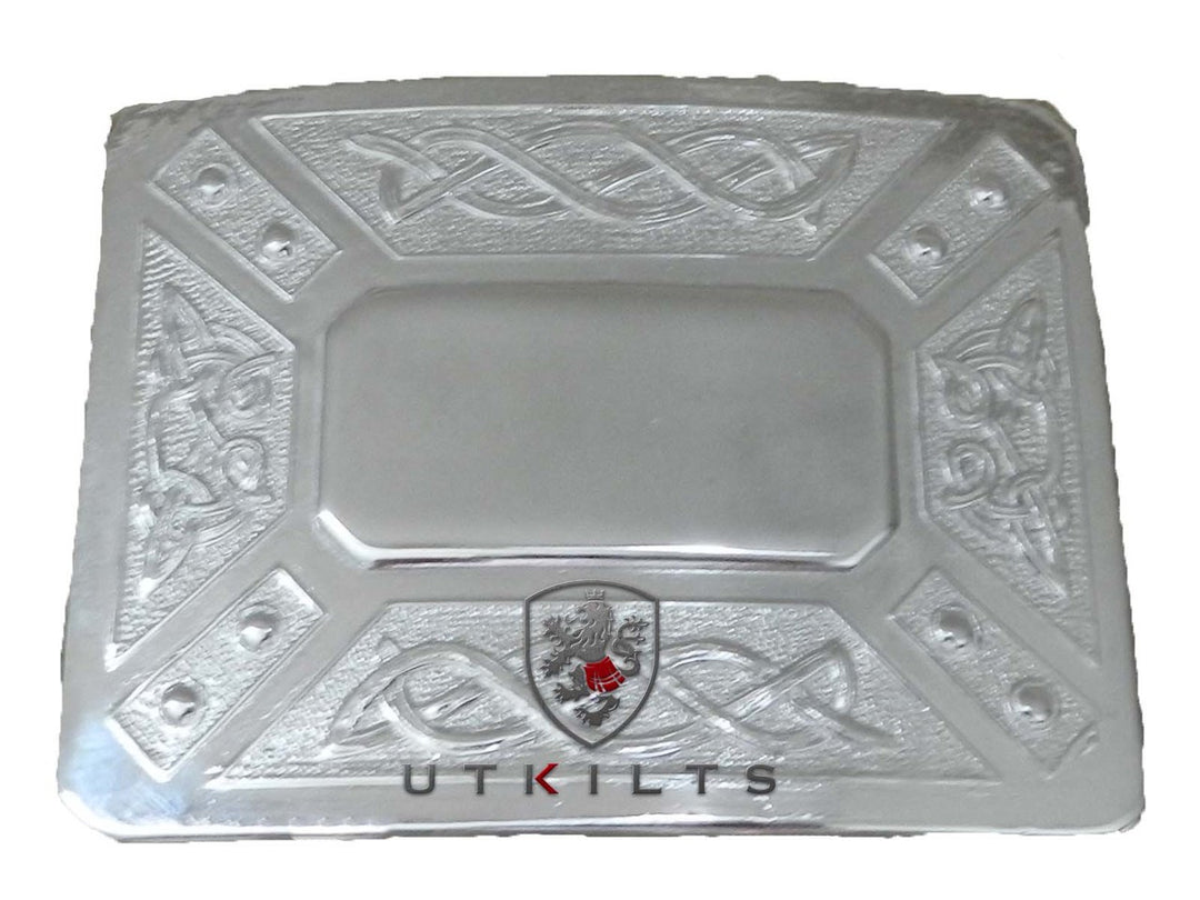 A silver plate featuring an intricate Celtic design, showcasing craftsmanship and elegance in its detailed patterns.