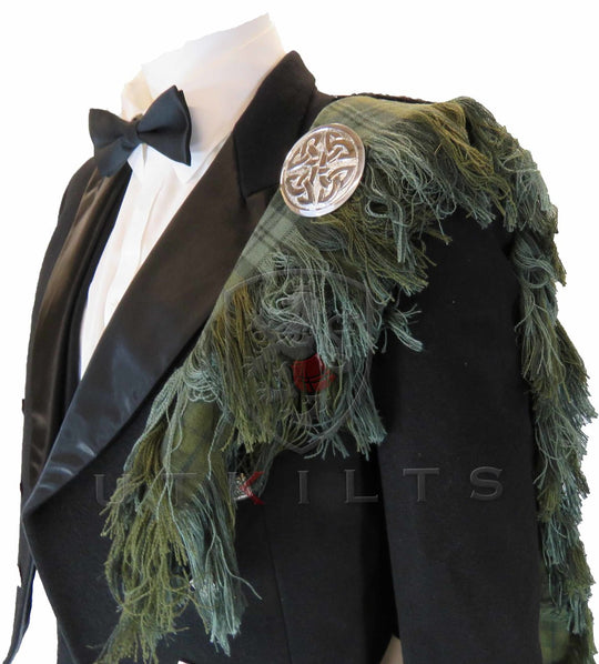 A mannequin dressed in a black suit complemented by a vibrant green tie, showcasing a formal attire display.