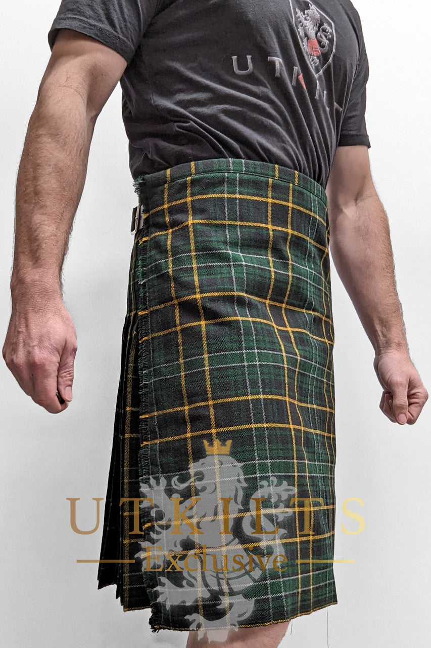 A man proudly wears a green and yellow tartan kilt, showcasing a unique style from UTK Exclusives.