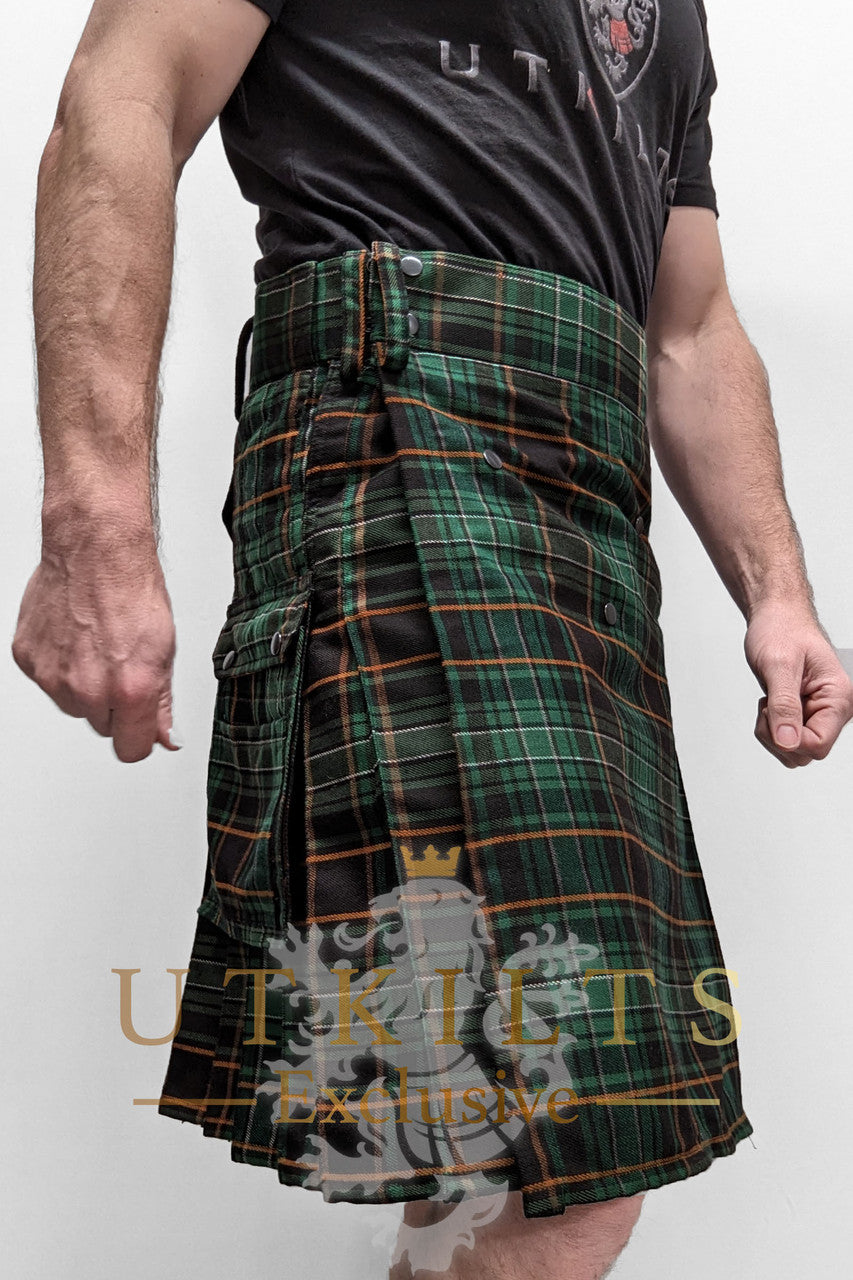 A man wearing a kilt, complemented by a black shirt, presents a striking appearance from the front view.