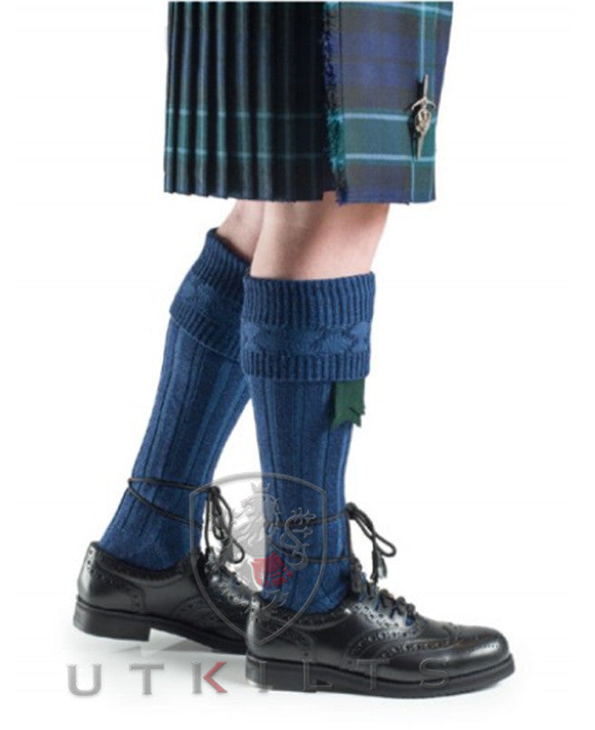 A man in a kilt paired with Premium Lomond Blue Kilt Hose and black shoes,