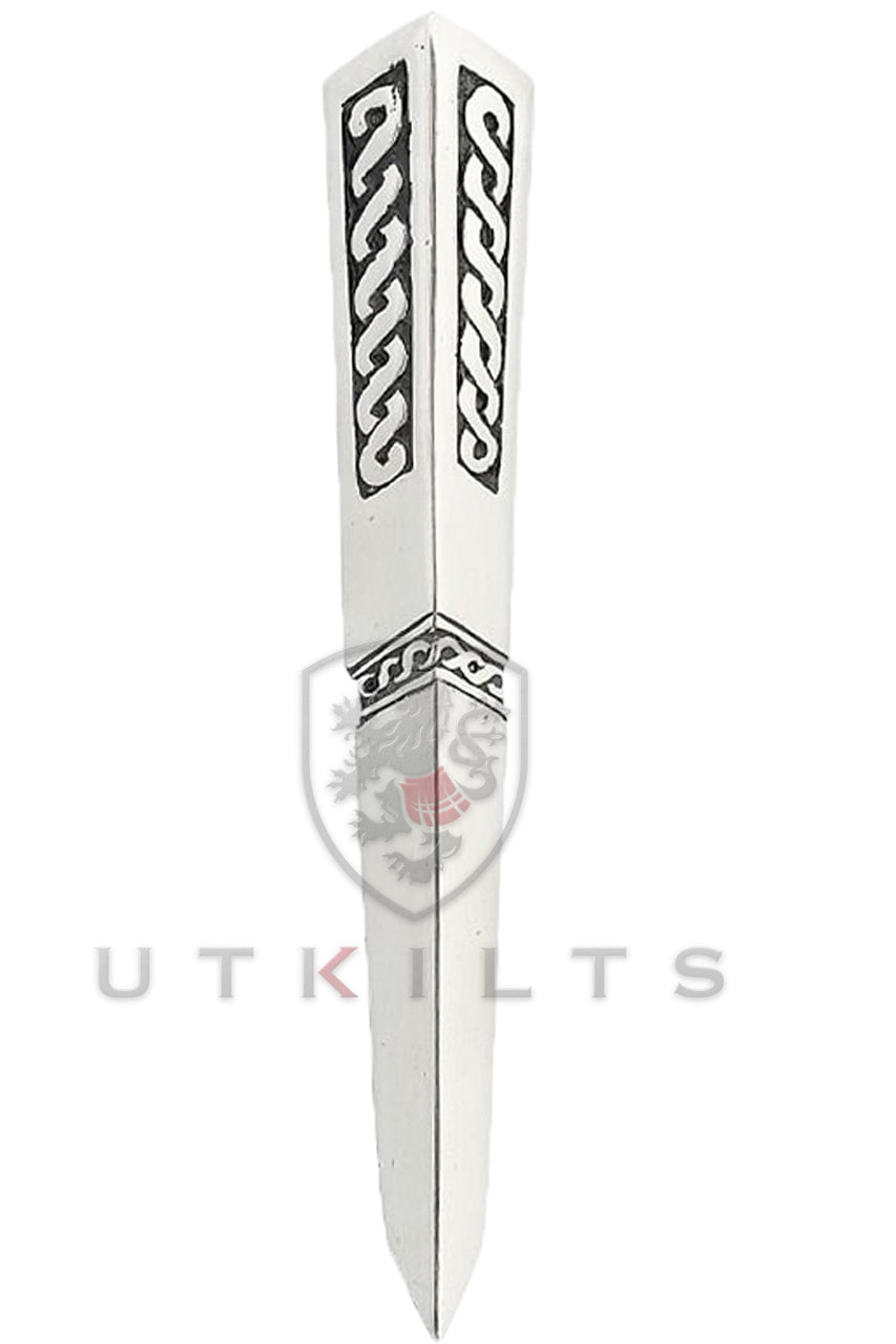 A silver knife featuring intricate Celtic designs