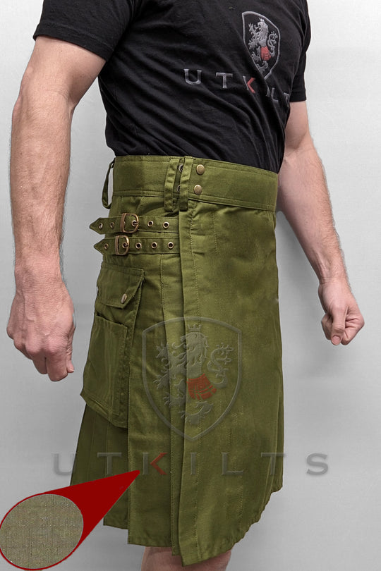 A man in a standard olive green utility kilt, with a red arrow indicating the kilt's features.