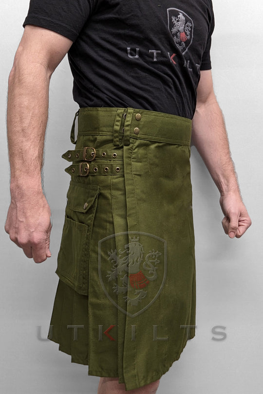 A man dressed in a standard olive green utility kilt with buttons, highlighting a distinctive and versatile garment.