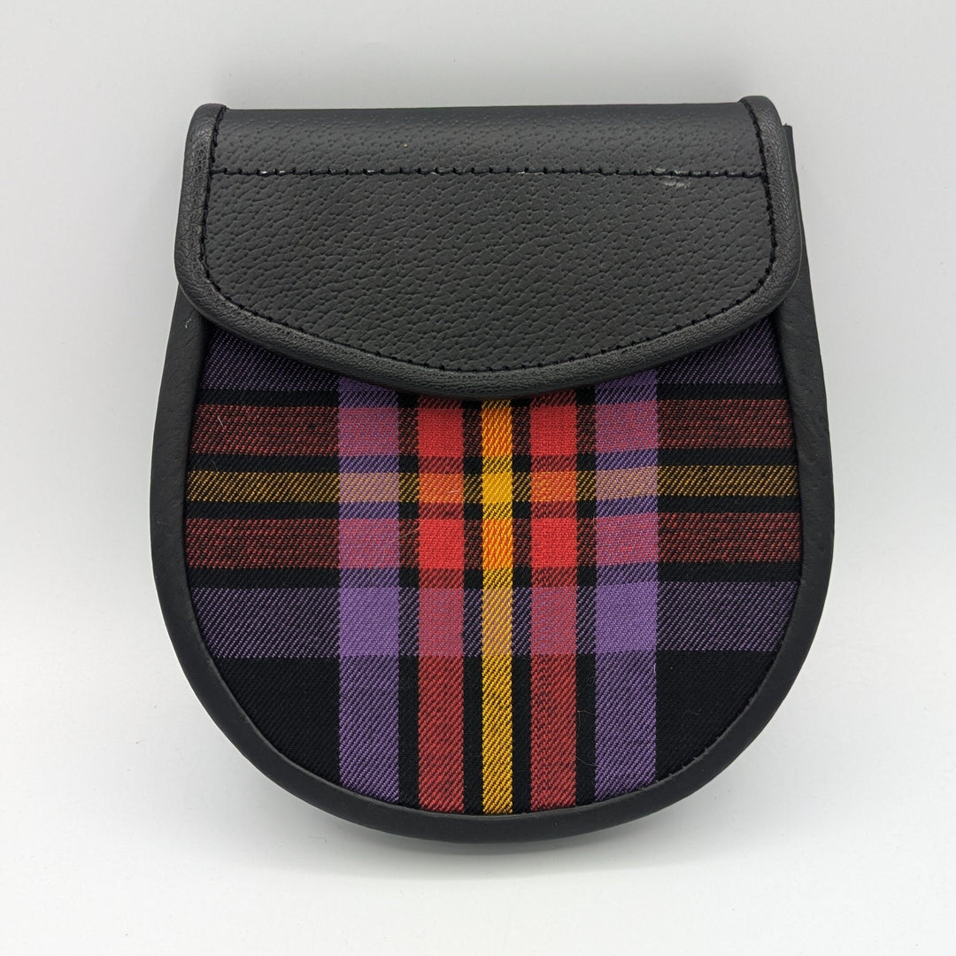 A stylish black and purple plaid purse