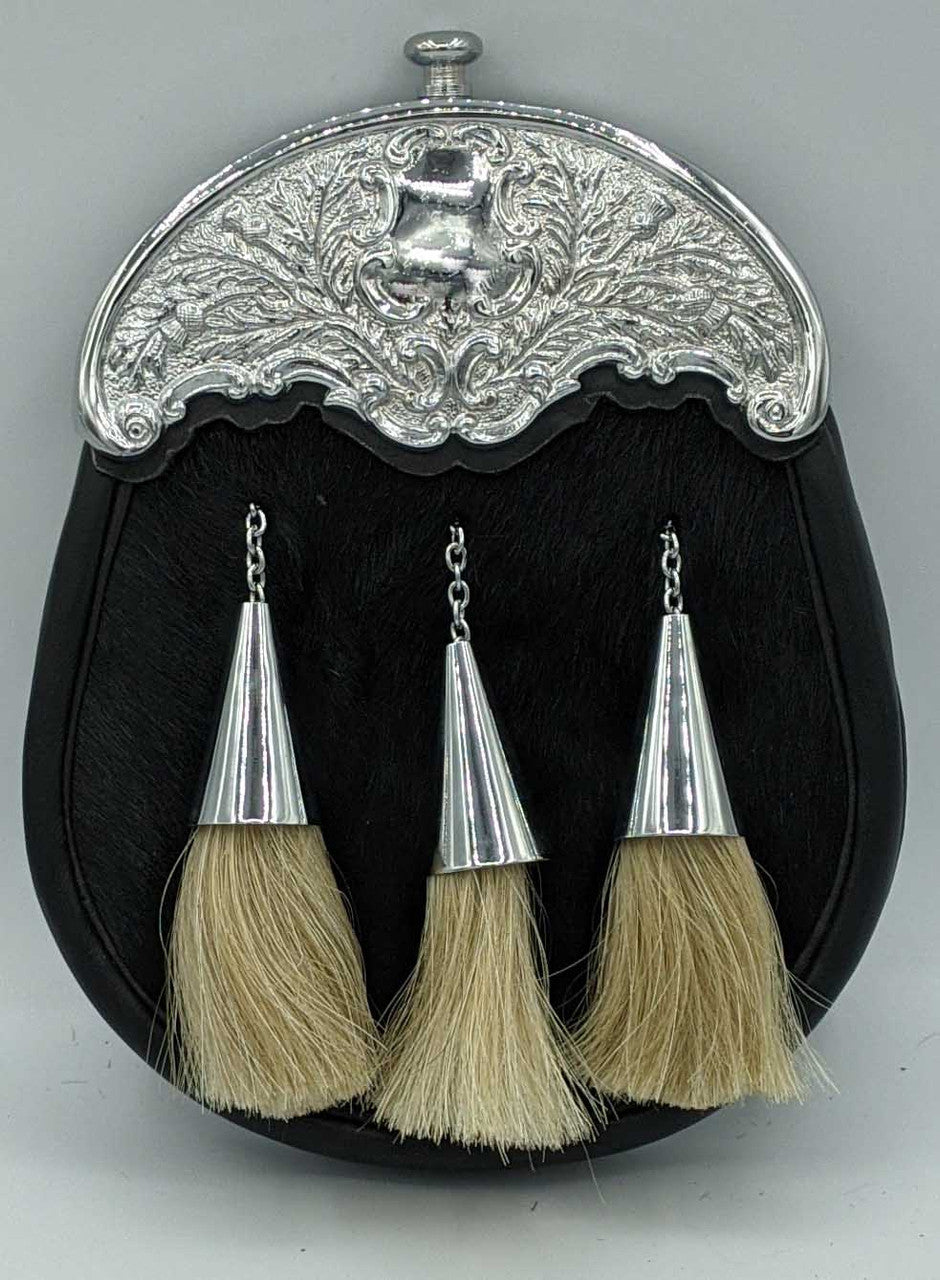 An elegant silver purse with three decorative tassels, ideal for formal dress, highlighting a classic and sophisticated look.