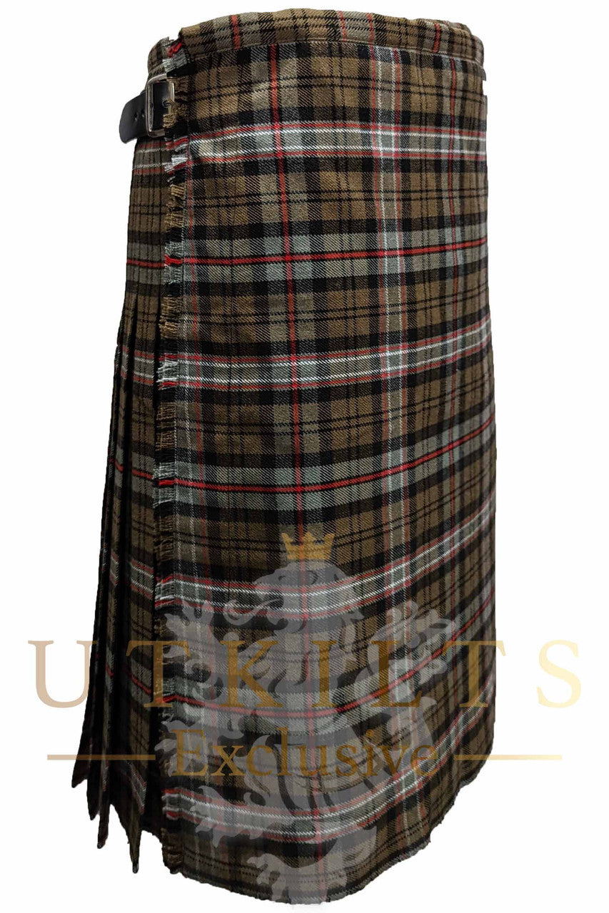 A brown and black tartan kilt showcasing the "Front side - UTK Exclusives" label, emphasizing its unique design.