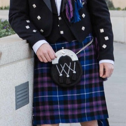  A man in a kilt poses for a photo, showcasing the Prince Charlie Formal Kilt Package starting at $299.50.