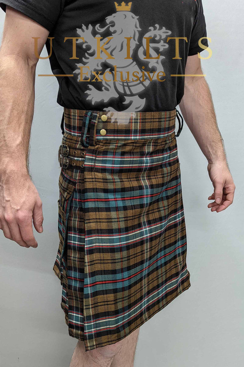 A man wearing a kilt, complemented by a black shirt and brown plaid, displayed in a front-side perspective for UTK Exclusives.