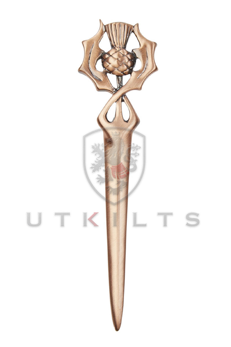 A premium Scottish thistle kilt pin with a copper finish, featuring a sword, set against a white background.