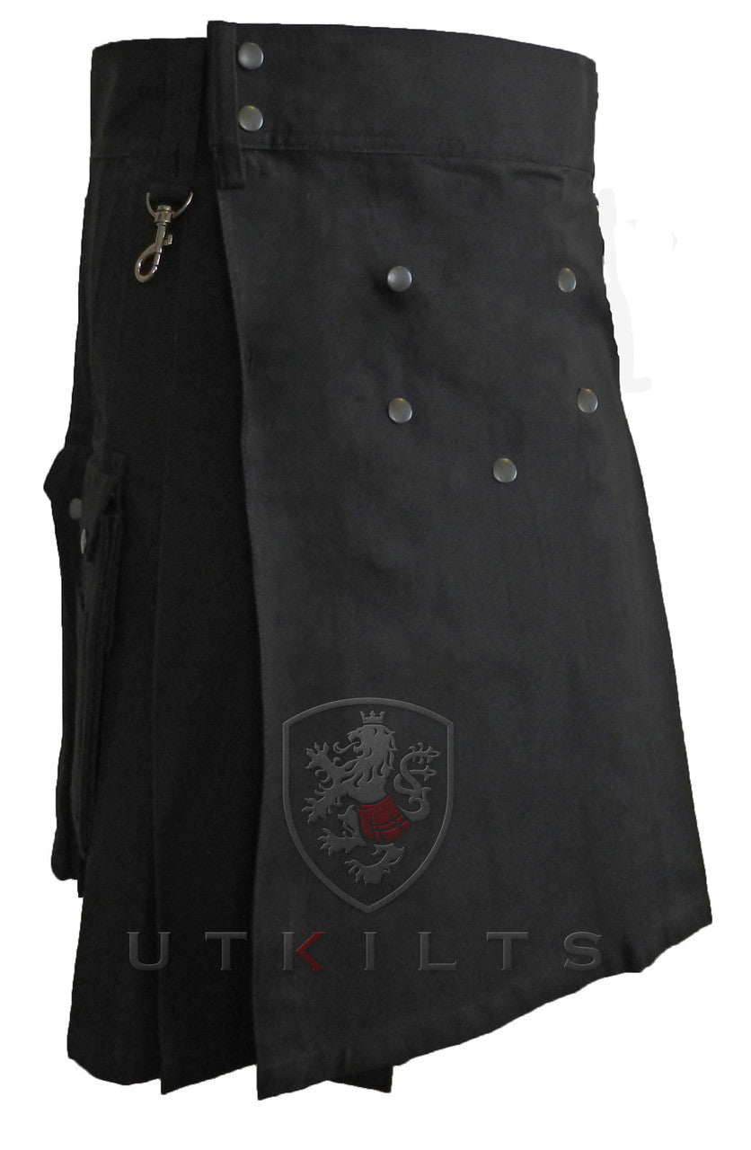Front view of a black kilt with buttons and a striking red crest, ideal for outdoor adventures and wilderness exploration.