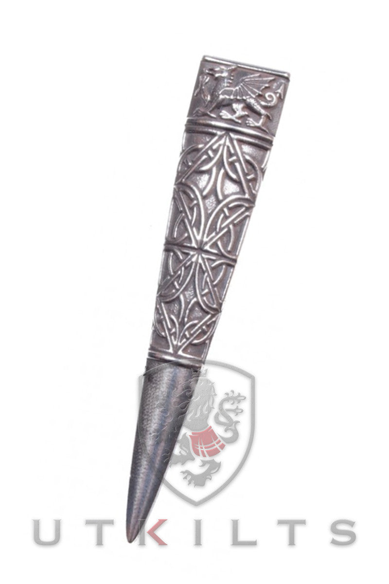A silver metal dagger featuring intricate Celtic designs on the blade and hilt, showcasing craftsmanship and artistry.