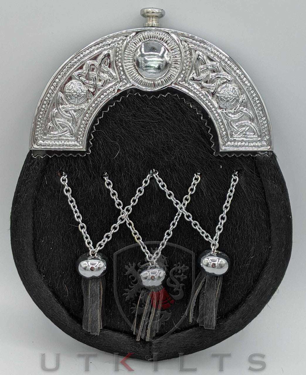 A stylish silver with three tassels, designed to enhance a formal dress sporran with horse hair and thistle details.